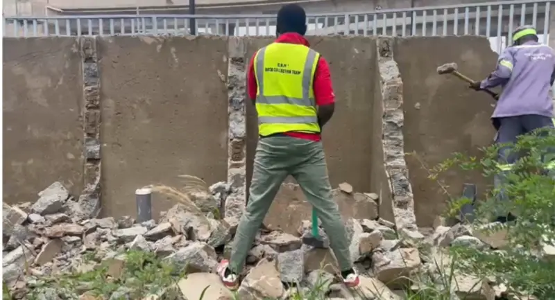 Ga North Assembly demolishes toilet facility under Pokuase Interchange